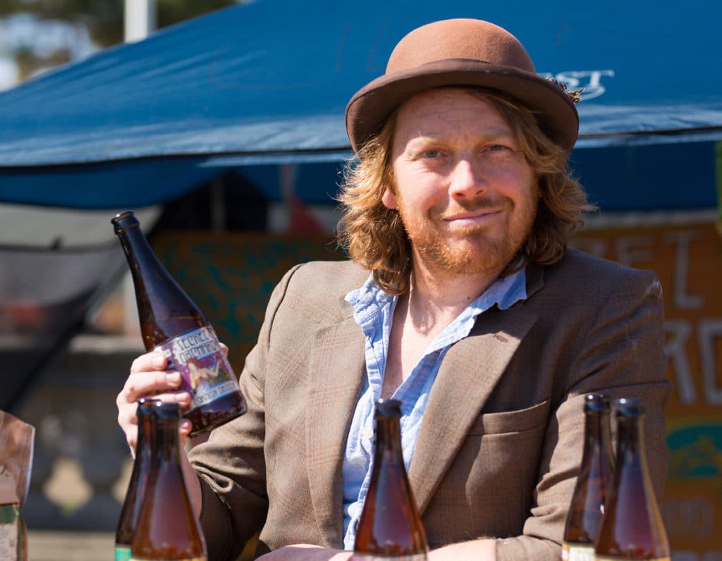 Man enjoying a Secret Orchard cider