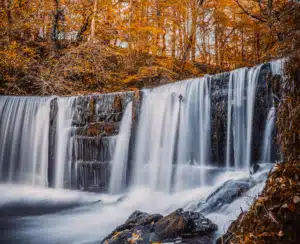 Autumnal waterfall image