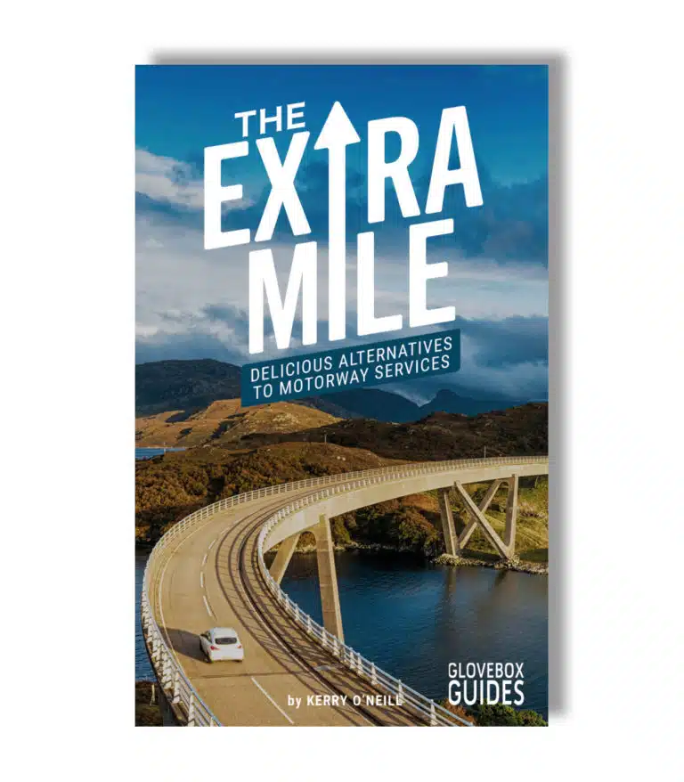 Cover of The Extra Mile Guide edition 4 with bridge and car