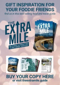 The Extra. Mile Guide Christmas poster with twinkling background