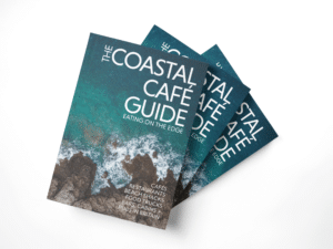 Image of three copies of The Coastal Café Guide