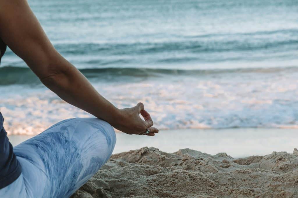 Beach yoga relaxation image by Chelsea Gates