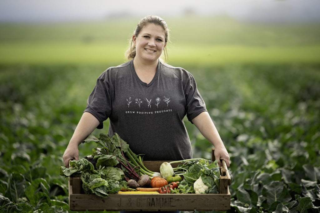A woman in a field with fresh crops at Westerton Farm