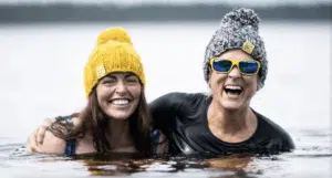 Two women wild swimmers wearing Findra merino wool (c) Findra