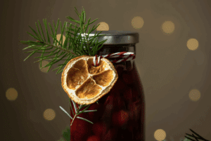 Gorgeous present of homemade jam in a jar with Christmas trimmings